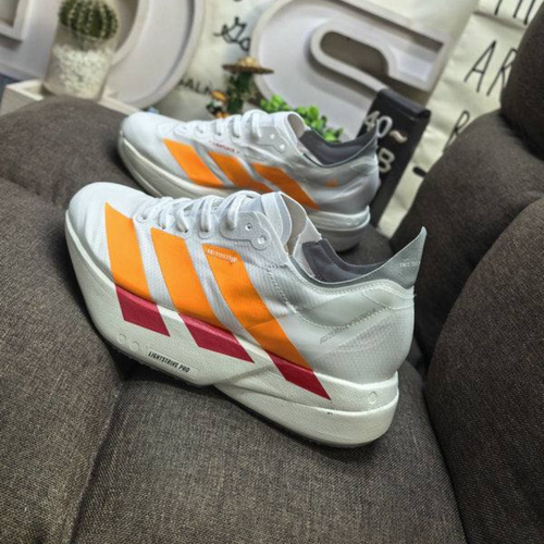 Adidas Adizero Adios Pro 4™ – Blanc avec Orange