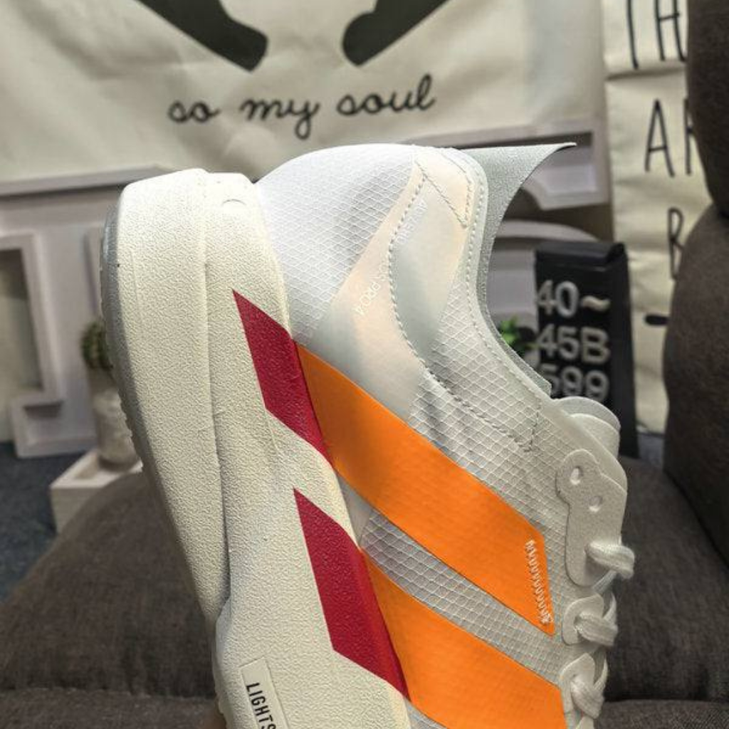 Adidas Adizero Adios Pro 4™ – Blanc avec Orange
