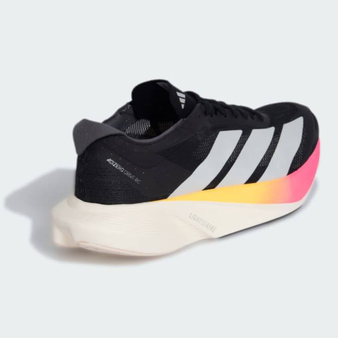 Adidas Adizero Drive RC™ – Core Black avec White, Zero Metallic et Spark