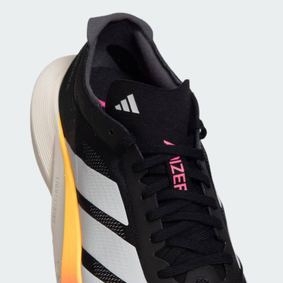 Adidas Adizero Drive RC™ – Core Black avec White, Zero Metallic et Spark